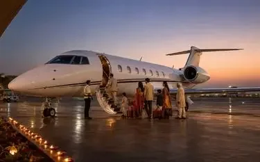 Diwali Private Jet Travel Private jet on the apron before a Diwali evening departure for a family charter flight