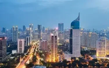 Private Jet from Jakarta Halim to Batulicin Bersujud Airport Jakarta city skyline with illuminated skyscrapers, departure point for private jet charters from Halim to Batulicin Bersujud