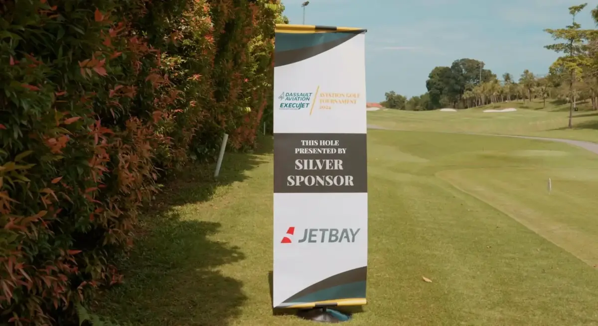 Jetbay silver sponsor signage at Dassault Aviation Execujet golf tournament showcasing luxury aviation partnerships