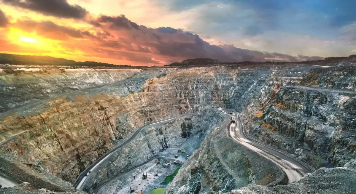 Aerial view of a mine in Indonesia at sunset, illustrating remote mining site access served by private jet charter flights