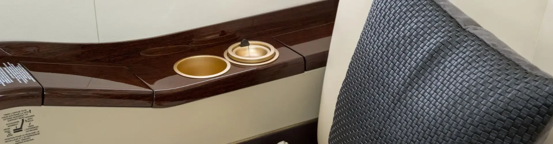 Private Jet vs Business Class: Which Is Better for Indonesia Travel? Private jet cabin interior detail showing premium leather seat, highlighting onboard comfort unavailable in business class