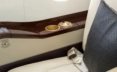 Private Jet vs Business Class: Which Is Better for Indonesia Travel? Private jet cabin interior detail showing premium leather seat, highlighting onboard comfort unavailable in business class