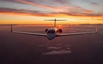 Private jet flying above clouds at sunset, representing premium charter flight services across the United Kingdom