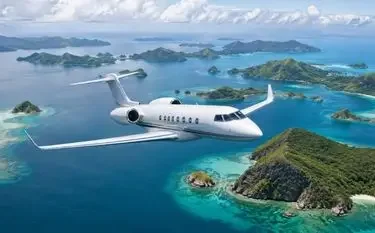 The Ultimate Guide to Sewa Jet Pribadi in Indonesia Private jet flying between islands in Indonesia
