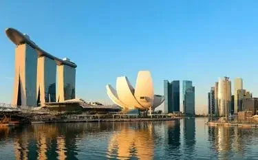 Private Jet from Singapore Seletar to Jakarta Halim Singapore Marina Bay skyline at golden hour featuring Marina Bay Sands and ArtScience Museum