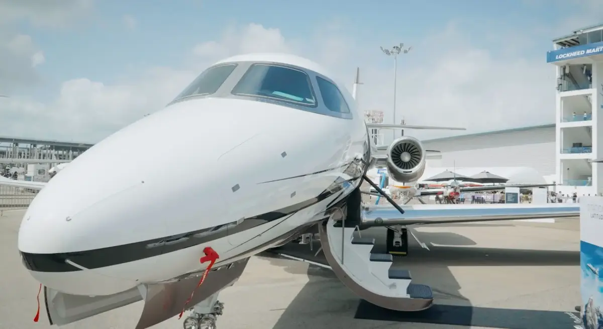 Sleek white business jet on display at Singapore Airshow showcasing latest aviation technology and luxury