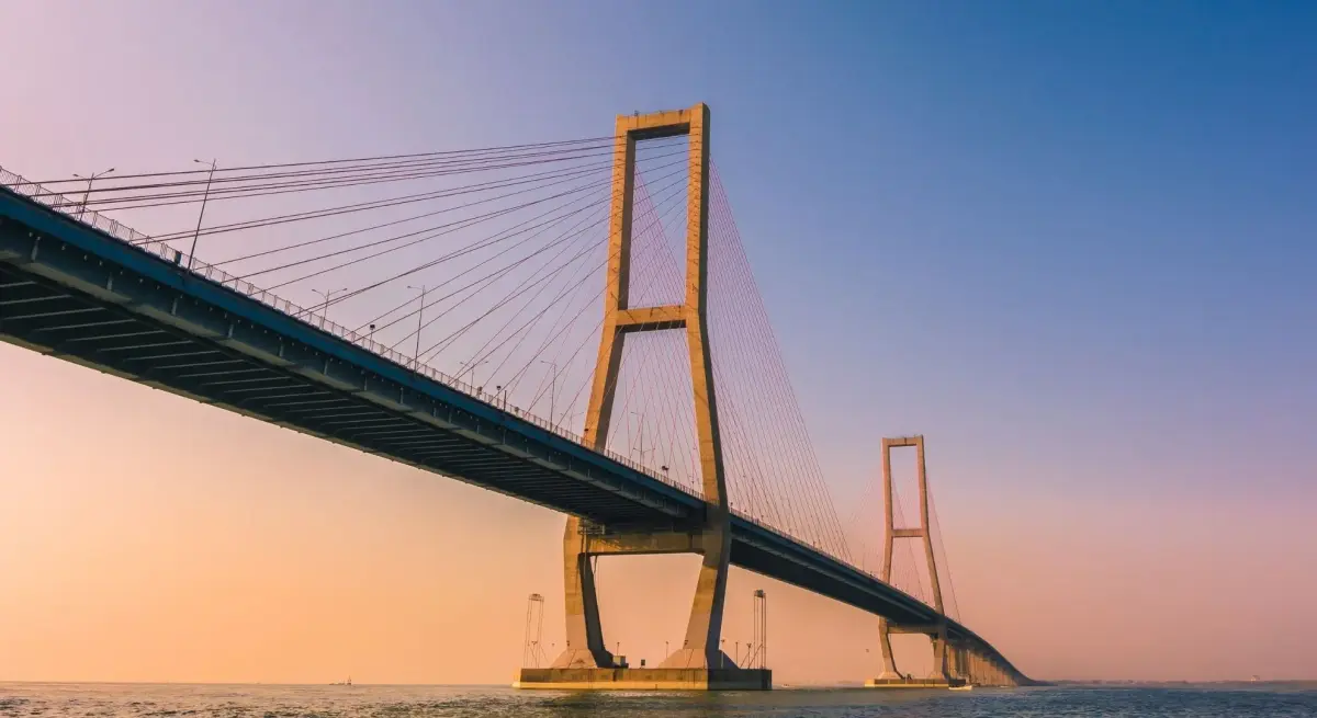 Suramadu Bridge connecting Java's northern coastline at golden hour, a landmark visible on private jet
