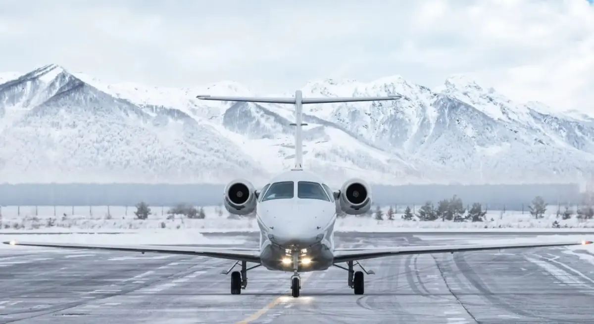 Private jet preparing for winter departure from an FBO ramp after deicing checks