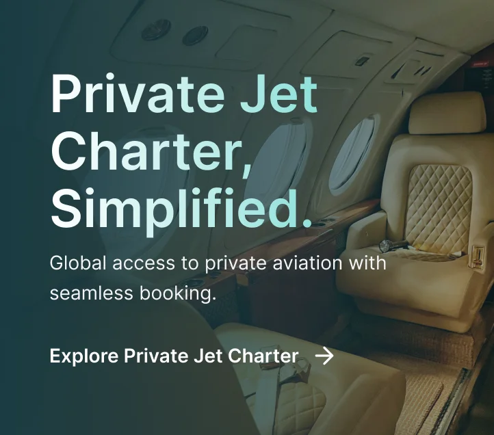 Luxurious private jet cabin interior with cream leather seats and polished wood finishes