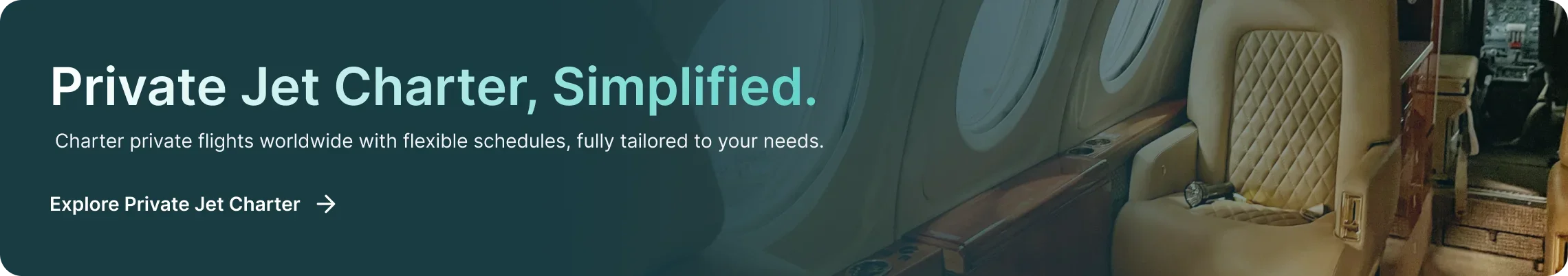 Luxurious private jet cabin interior with cream leather seats and polished wood finishes