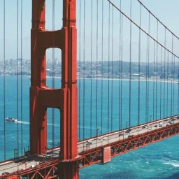 Golden Gate Bridge spanning San Francisco Bay with iconic red towers and suspension cables