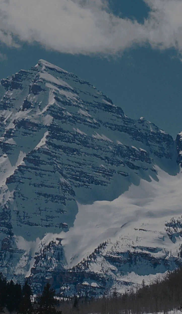 Snow-capped mountain peaks and glaciers in Aspen, Colorado - premier ski destination for luxury travel