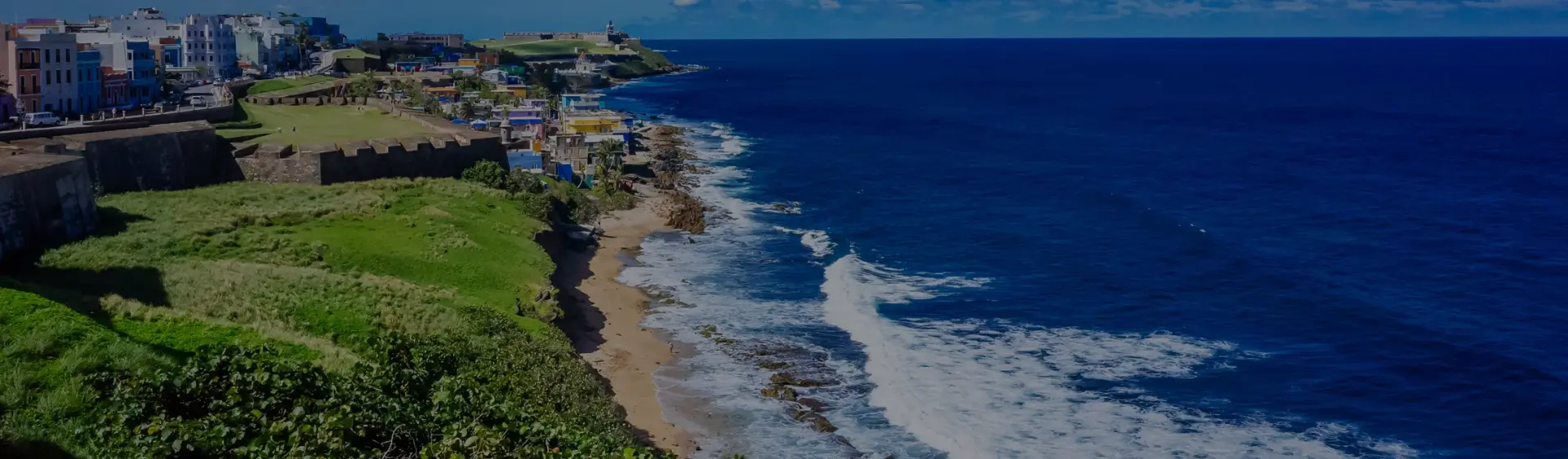 Stunning aerial view of San Juan's historic coastline with colonial architecture and pristine beaches