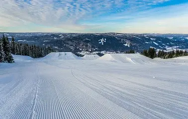 Pristine groomed ski slopes with fresh powder snow overlooking mountain valleys in Sun Valley Idaho