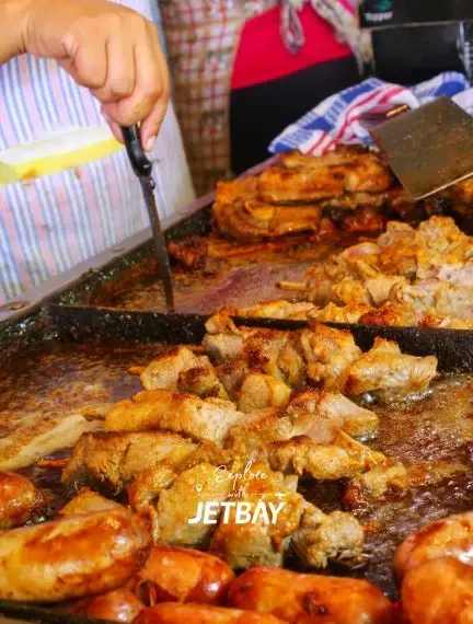 Traditional Paraguayan grilled meat being prepared at local Asuncion market showcasing authentic cuisine
