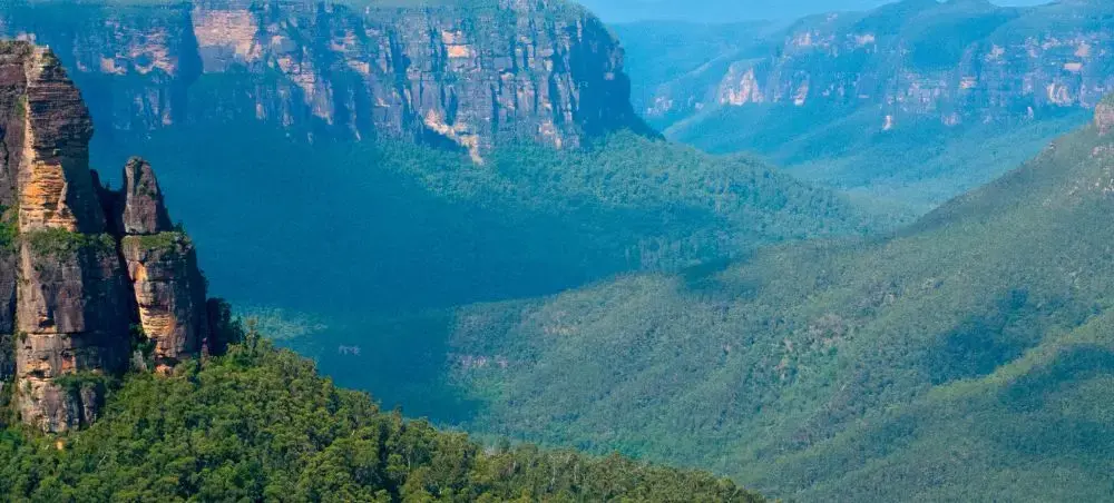Dramatic Blue Mountains canyon vista with eucalyptus forests and sandstone cliffs near Sydney Australia