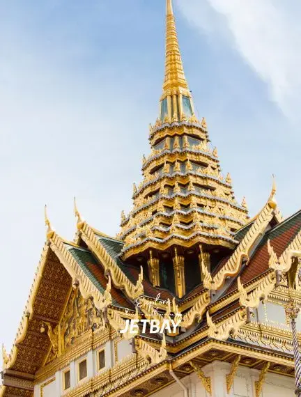 Golden spires and ornate rooftops of traditional Thai temple architecture in Bangkok's historic district