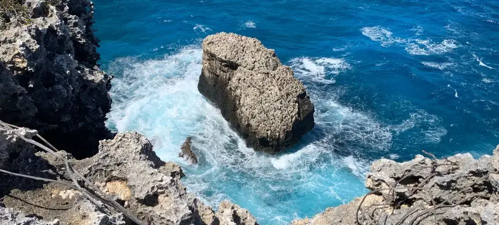 Beach resort and clear coastal waters in Cayman Brac on a private jet charter itinerary