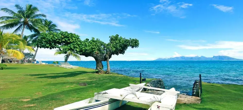 Beach resort and clear coastal waters in Papeete on a private jet charter itinerary