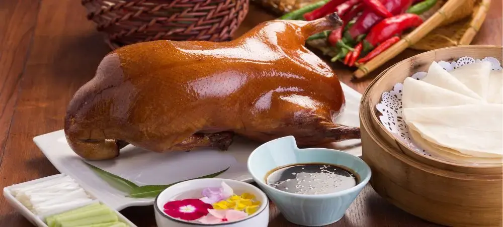 Authentic Peking duck with pancakes and traditional accompaniments showcasing Beijing's renowned culinary heritage