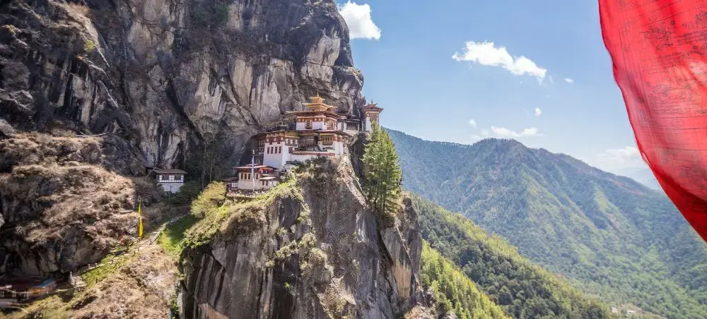 Tiger's Nest Monastery perched dramatically on cliff face in Bhutan's Paro Valley mountains