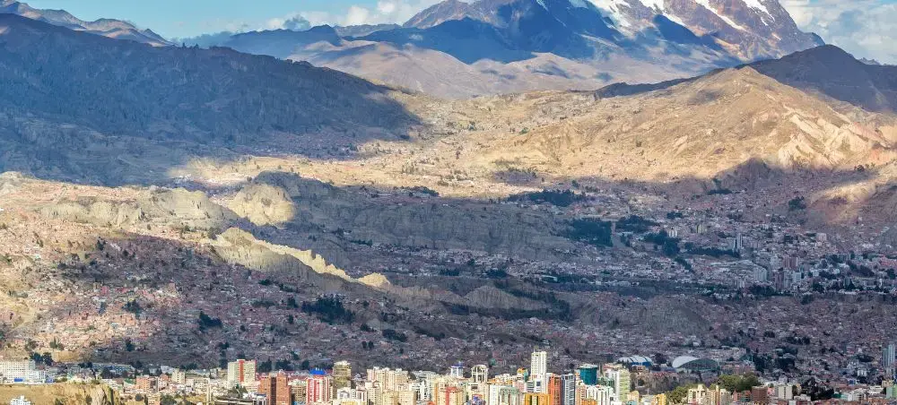 Panoramic view of La Paz Bolivia nestled in dramatic Andes mountains showcasing high-altitude cityscape