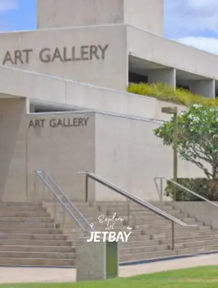 Modern concrete art gallery building with stairs and landscaping in Brisbane's cultural district
