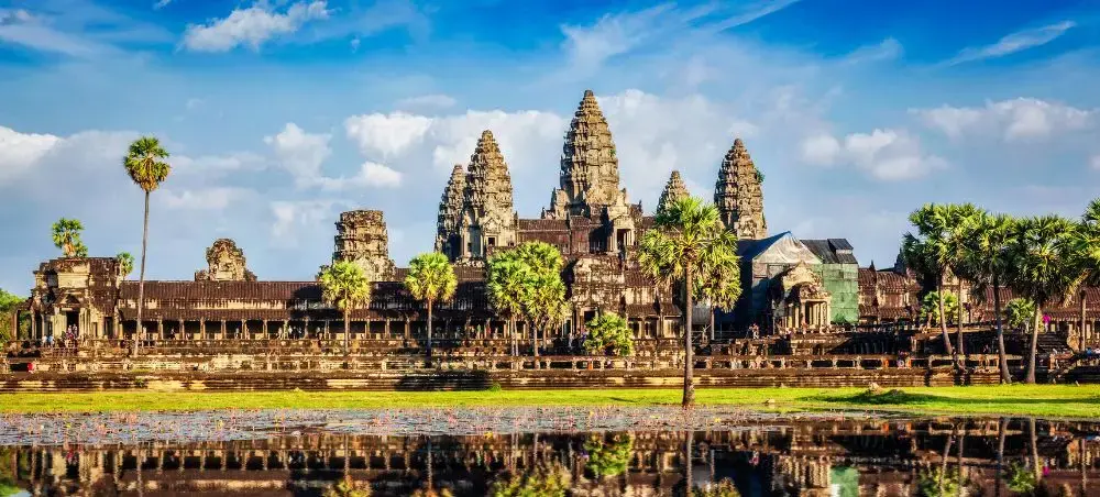 Angkor Wat temple complex reflected in water showcasing Cambodia's ancient Khmer architecture and heritage