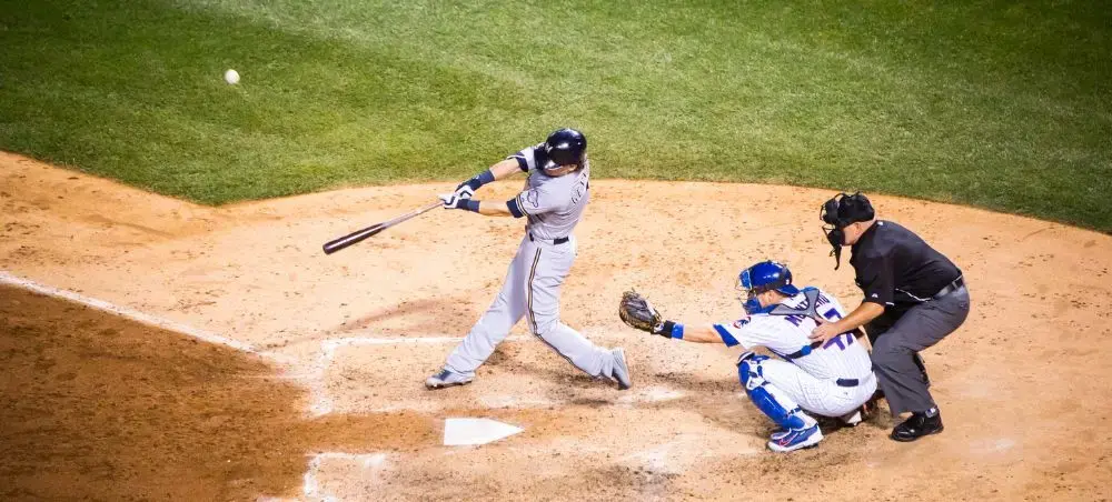 Baseball game action at home plate showcasing Chicago's premier sports entertainment venues