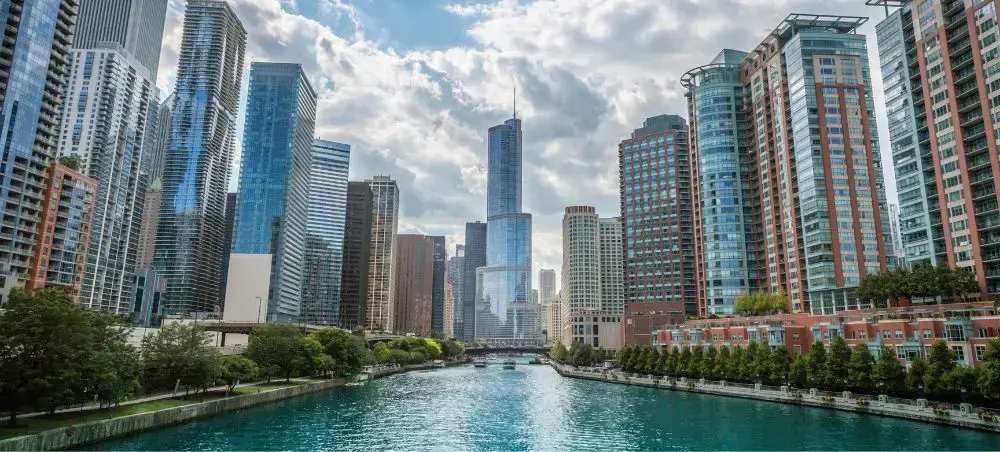 Chicago River flowing through downtown skyline with towering skyscrapers and luxury high-rises