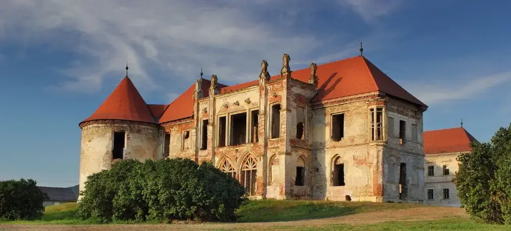 Historic Banffy Castle with red-tiled roofs and Gothic architecture near Cluj-Napoca, Romania