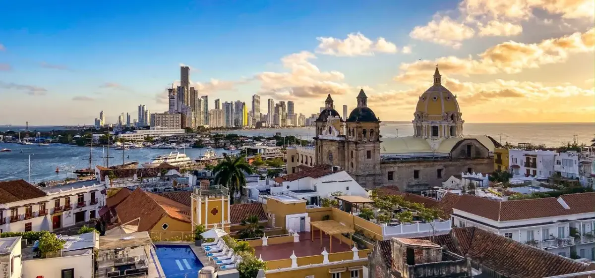 Stunning aerial view of Cartagena's historic colonial architecture and modern skyline at golden hour sunset