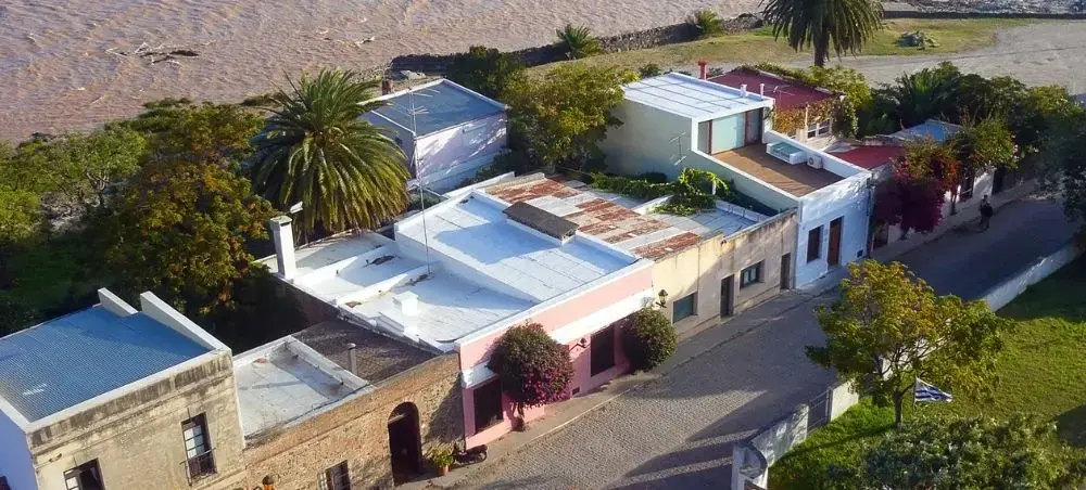 Aerial view of historic colonial buildings with terracotta roofs in Colonia del Sacramento, Uruguay