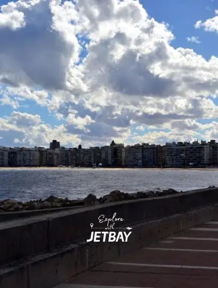 Colonia del Sacramento waterfront with historic buildings and dramatic clouds over Rio de la Plata