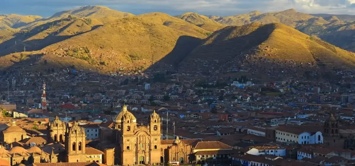 Cusco skyline and waterfront district photographed from a private aircraft on final approach