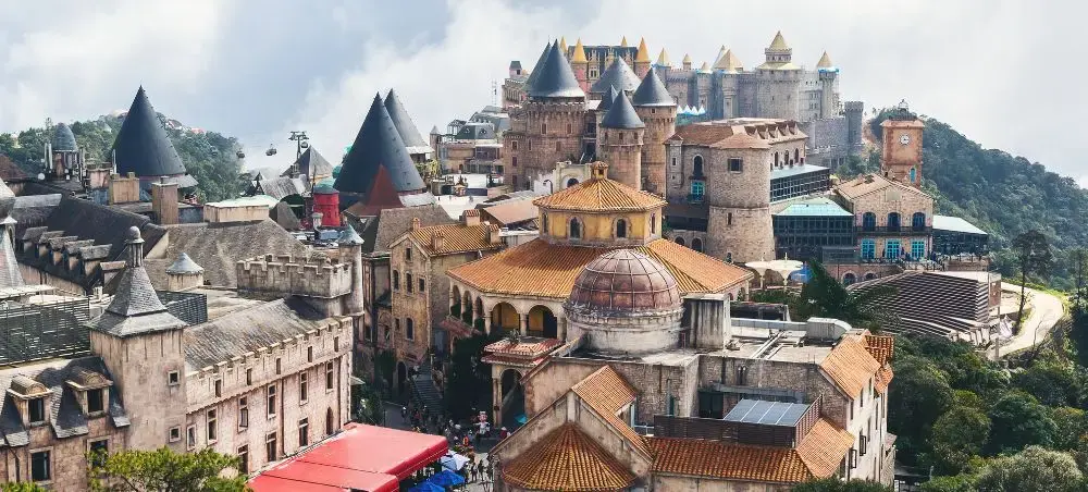Medieval castle complex with distinctive conical towers and terracotta roofs in Da Nang, Vietnam
