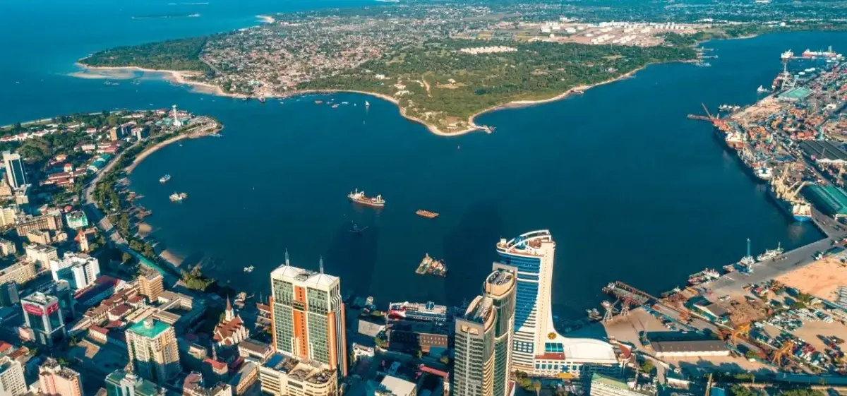Aerial view of Dar es Salaam's bustling harbor and modern skyline along Tanzania's Indian Ocean coast