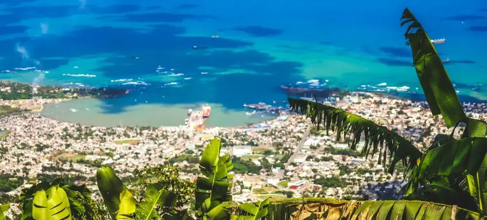 Panoramic view of Dominican Republic coastal city with turquoise Caribbean waters and lush tropical foliage