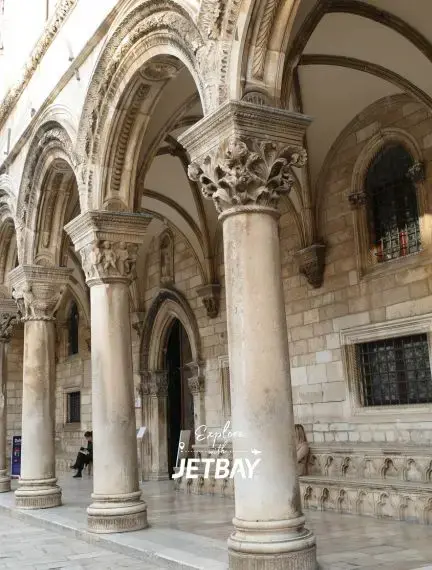 Ornate stone columns and arches of Rector's Palace courtyard in Dubrovnik's historic Old Town