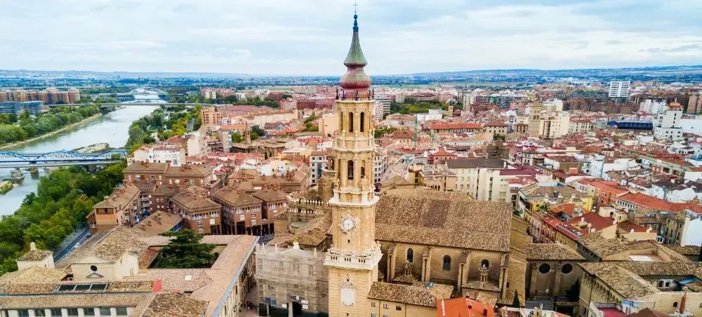 Aerial view of historic cathedral and red-tiled rooftops in El Salvador's colonial city center