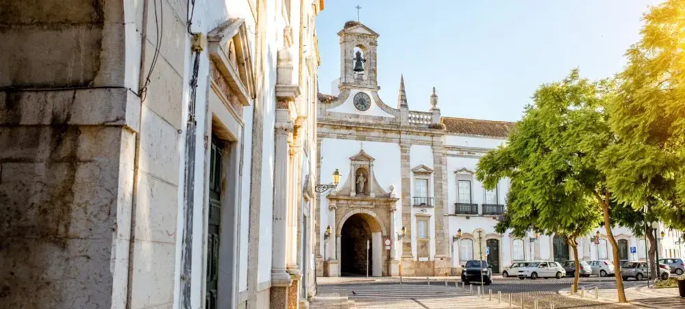Historic cathedral and baroque architecture in Faro's old town square showcasing Portugal's cultural heritage
