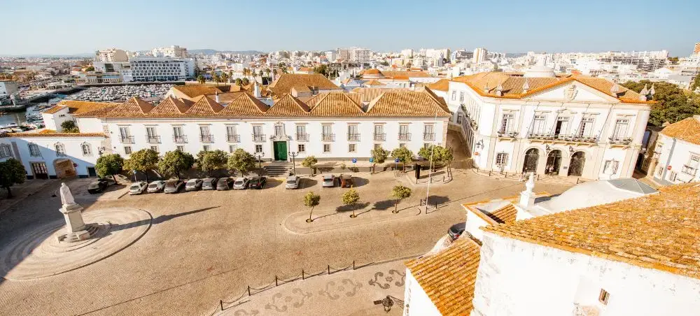Historic Faro city center with traditional Portuguese architecture and terracotta rooftops in the Algarve
