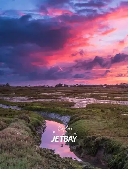 Dramatic sunset over Ria Formosa wetlands near Faro showcasing Portugal's stunning coastal landscapes