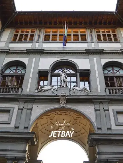 Historic Uffizi Gallery courtyard archway in Florence showcasing Renaissance architecture for luxury travelers