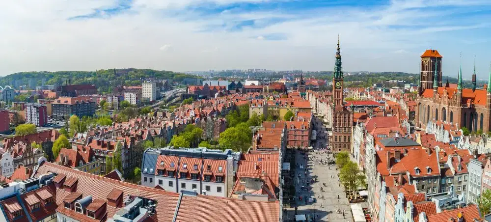 Aerial view of Gdansk's historic Old Town showcasing red-tiled roofs, Gothic architecture, and medieval streets