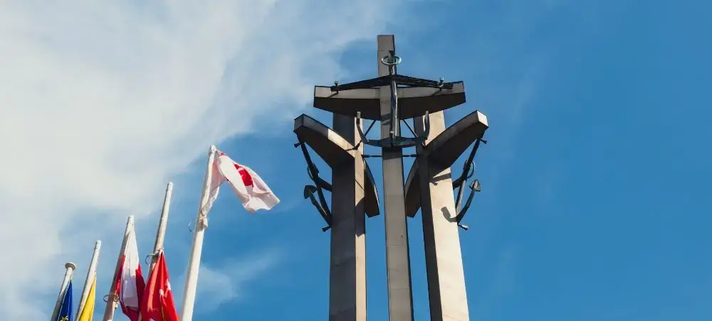 Monument of the Fallen Shipyard Workers with Polish flag flying in Gdansk's historic center