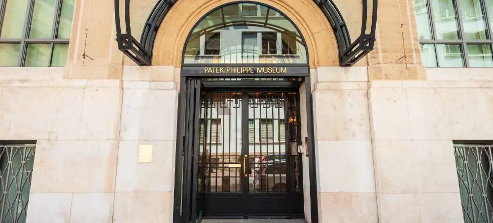 Elegant entrance to Patek Philippe Museum in Geneva showcasing luxury Swiss watchmaking heritage