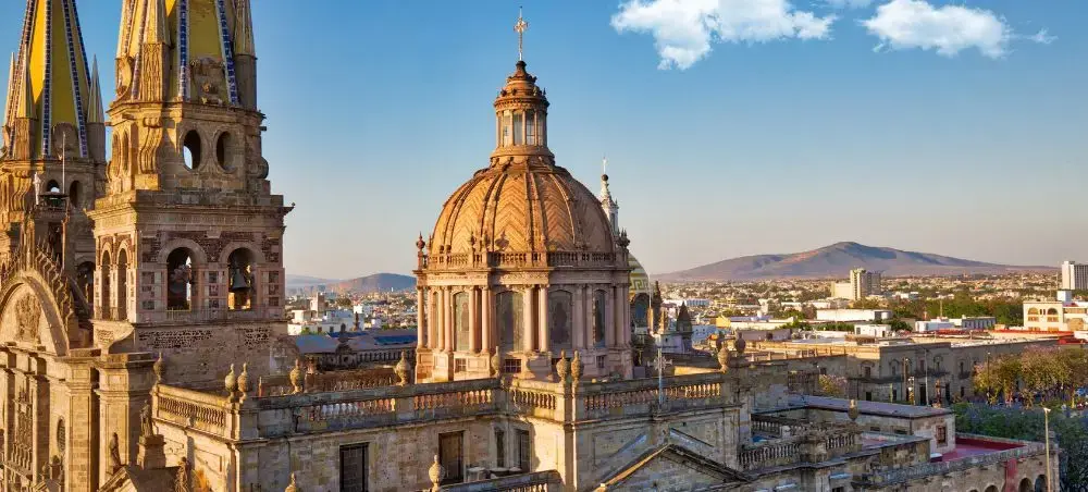 Golden hour illuminates Guadalajara Cathedral's baroque towers and dome overlooking Mexico's vibrant city