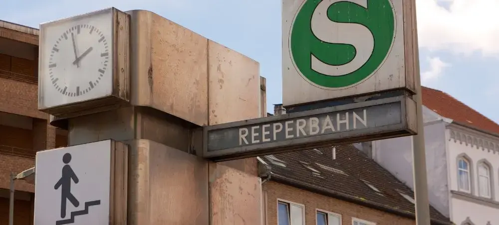 Reeperbahn S-Bahn station sign with clock in Hamburg's famous entertainment district