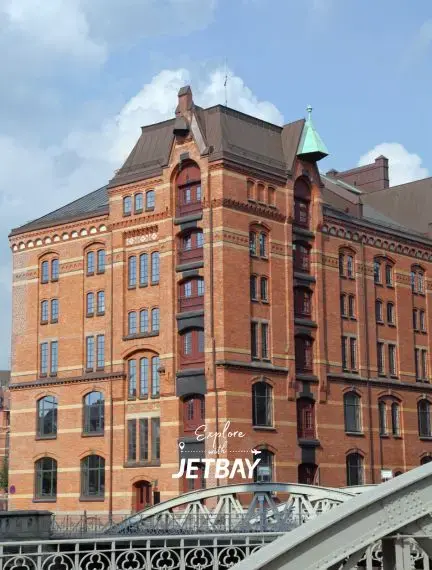 Historic red brick warehouse building in Hamburg's Speicherstadt district with ornate Victorian architecture